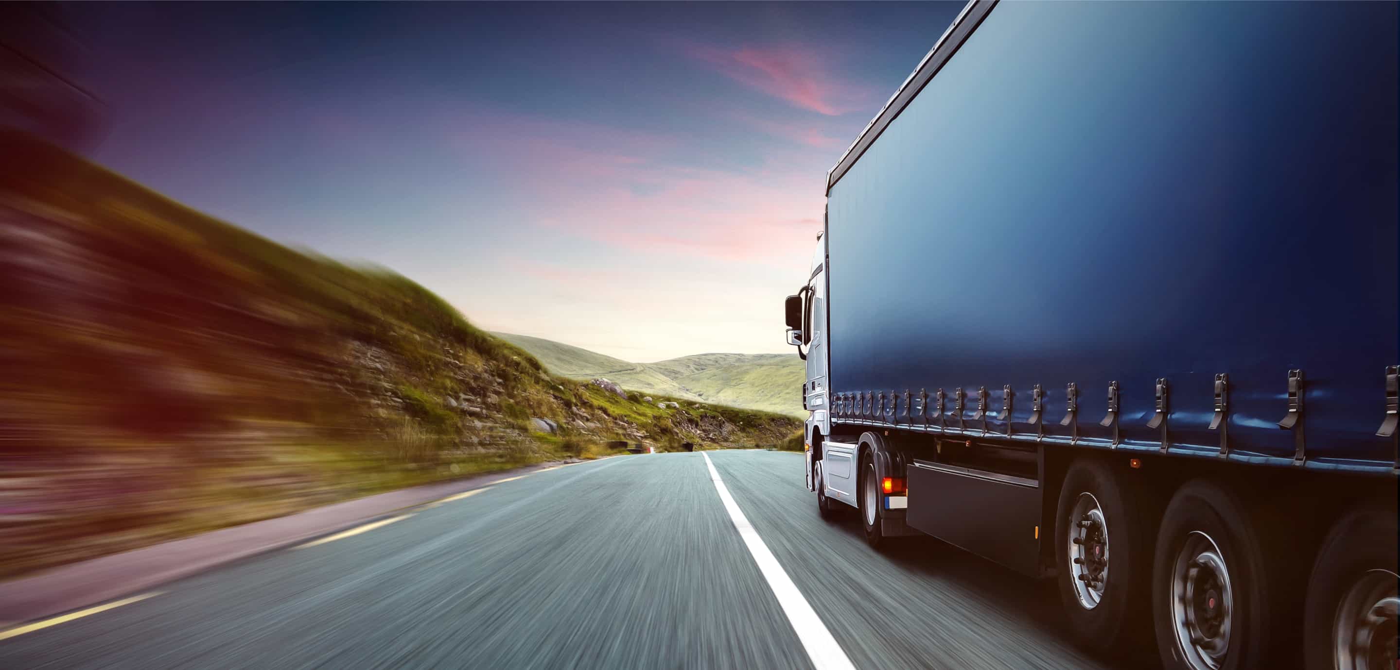 Truck on a scenic road at dusk