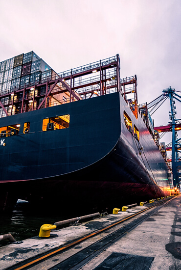 Massive ship at port for transporting goods